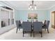 Elegant dining room featuring a modern chandelier and large window with abundant natural light at 11266 Old Stone Dr, Indianapolis, IN 46236