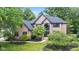 Beautiful brick home with a well-manicured lawn and mature trees offering shade at 11266 Old Stone Dr, Indianapolis, IN 46236
