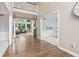 Spacious foyer with hardwood floors opening to a living room with large windows at 11266 Old Stone Dr, Indianapolis, IN 46236
