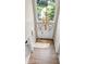 Foyer with chandelier, hardwood floors and large window above front door at 11266 Old Stone Dr, Indianapolis, IN 46236
