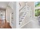 Elegant foyer with hardwood floors and high ceilings, showcasing a grand staircase at 11266 Old Stone Dr, Indianapolis, IN 46236