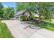 Detached two-car garage with grey doors and a brick exterior with an extra long driveway at 11266 Old Stone Dr, Indianapolis, IN 46236