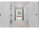 Inviting hallway with tile flooring leading to a bright, spacious bathroom at 11266 Old Stone Dr, Indianapolis, IN 46236