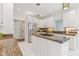Well-lit kitchen featuring white cabinets, stainless steel appliances, granite countertops, and tile flooring at 11266 Old Stone Dr, Indianapolis, IN 46236