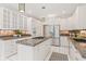 Modern kitchen featuring white cabinets, granite countertops, stainless steel appliances, and pendant lighting at 11266 Old Stone Dr, Indianapolis, IN 46236