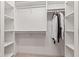 Functional walk-in closet with white shelving and hanging storage for organization at 11266 Old Stone Dr, Indianapolis, IN 46236