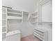 Spacious walk-in closet featuring white shelving and ample storage options at 11266 Old Stone Dr, Indianapolis, IN 46236