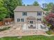 Aerial view of a home featuring a beautiful backyard, patio, pond, mature trees, and green grass at 11763 Igneous Dr, Fishers, IN 46038