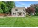 Large backyard with a charming pond and patio; excellent for relaxing or entertaining at 11763 Igneous Dr, Fishers, IN 46038