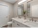 Bathroom featuring double sinks with quartz countertops, and modern fixtures at 11763 Igneous Dr, Fishers, IN 46038