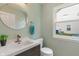 Stylish half bathroom features modern fixtures, vanity, and natural light at 11763 Igneous Dr, Fishers, IN 46038