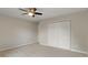 Bedroom featuring a ceiling fan, closet, and a large window at 11763 Igneous Dr, Fishers, IN 46038