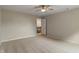 Neutral bedroom featuring a ceiling fan and doorway leading to the home's second floor at 11763 Igneous Dr, Fishers, IN 46038