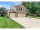 Charming two-story home with a three car garage, well-maintained lawn, and inviting curb appeal at 11763 Igneous Dr, Fishers, IN 46038
