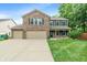 Classic two-story brick home with blue shutters, mature trees, and a well-maintained lawn at 11763 Igneous Dr, Fishers, IN 46038