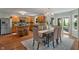 Beautiful eat-in kitchen features wood cabinets, stainless steel appliances, granite counters, and modern lighting at 11763 Igneous Dr, Fishers, IN 46038