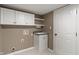 Functional laundry room with cabinets and utility sink for added convenience at 11763 Igneous Dr, Fishers, IN 46038