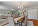 Spacious living room and dining area features recessed lighting, neutral paint, and backyard views at 11763 Igneous Dr, Fishers, IN 46038
