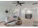 Comfortable living area features soft carpet, ceiling fan, and modern decor at 11763 Igneous Dr, Fishers, IN 46038