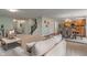 Open-concept living room, dining area and kitchen with hardwood floors and natural light at 11763 Igneous Dr, Fishers, IN 46038
