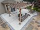 Inviting backyard patio with stylish pergola, comfortable seating, and elegant stone accents at 11763 Igneous Dr, Fishers, IN 46038