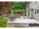 Spacious backyard patio featuring a pergola, outdoor seating, and a well-maintained lawn at 11763 Igneous Dr, Fishers, IN 46038