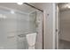 Clean shower with glass doors, white tile, and modern fixtures at 11763 Igneous Dr, Fishers, IN 46038