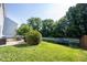 Backyard featuring a patio area with dining set and a trampoline on the lawn at 13829 Black Canyon Ct, Fishers, IN 46038