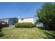 Green backyard with white privacy fence and partial view of the back of the home at 13829 Black Canyon Ct, Fishers, IN 46038