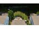 Aerial view of private backyard with mature landscaping, patio and trampoline at 13829 Black Canyon Ct, Fishers, IN 46038