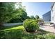 Spacious backyard featuring a lush lawn, manicured hedges, and a classic white picket fence at 13829 Black Canyon Ct, Fishers, IN 46038