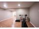 Finished basement space featuring a weightlifting bench and workout equipment at 13829 Black Canyon Ct, Fishers, IN 46038