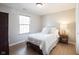 This comfortable bedroom has a large window and light colored walls and floors at 13829 Black Canyon Ct, Fishers, IN 46038