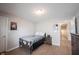 The cozy bedroom features a wooden frame bed, nice floors and natural light at 13829 Black Canyon Ct, Fishers, IN 46038