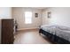 This cozy bedroom offers a comfortable sleeping space and lots of natural light at 13829 Black Canyon Ct, Fishers, IN 46038