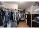 Walk-in closet with plenty of storage including hanging racks, shelving, and a dresser at 13829 Black Canyon Ct, Fishers, IN 46038