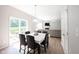 Bright dining area featuring a table with six chairs and sliding glass doors to the outdoor area at 13829 Black Canyon Ct, Fishers, IN 46038