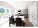 Bright dining area featuring a table with six chairs and sliding glass doors to the outdoor area at 13829 Black Canyon Ct, Fishers, IN 46038