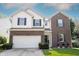Charming two-story home featuring a brick and white exterior, attached two-car garage, and well-maintained landscaping at 13829 Black Canyon Ct, Fishers, IN 46038