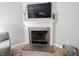 Close-up of the fireplace with decorative mantel and tiled surround in the living room at 13829 Black Canyon Ct, Fishers, IN 46038
