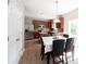 Bright and airy kitchen/eating area with wood cabinets, stainless steel appliances, view to the back yard at 13829 Black Canyon Ct, Fishers, IN 46038