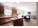 Open-concept kitchen with wood cabinets, stainless steel appliances, adjacent dining area and a spacious living room at 13829 Black Canyon Ct, Fishers, IN 46038