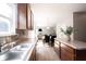 A spacious kitchen featuring wood cabinets, stainless steel appliances and open to the dining and living rooms at 13829 Black Canyon Ct, Fishers, IN 46038