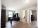 Comfortable office space featuring a large desk, shelving, and view into the main bedroom at 13829 Black Canyon Ct, Fishers, IN 46038
