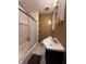 Bathroom with a shower-tub combo, a toilet and a white vanity in a cozy space at 1425 Sharon Ave, Indianapolis, IN 46222
