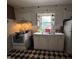 A traditional kitchen with a double sink and ample counter space with checkerboard flooring at 1425 Sharon Ave, Indianapolis, IN 46222