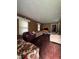 Spacious living room with dark hardwood floors, cozy sofas, and bright natural light from the windows at 1425 Sharon Ave, Indianapolis, IN 46222