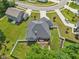 A birds-eye view of a backyard deck and patio, with well-manicured lawn surrounded by a white fence at 14729 Erica Ln, Carmel, IN 46033
