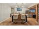 Close-up of basement bar with blue cabinetry, wood accents, modern lighting, stainless steel refrigerator, and elegant decor at 14729 Erica Ln, Carmel, IN 46033