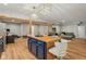 Spacious basement with stylish bar and lounge area, showcasing open layout, wooden beams, and contemporary design at 14729 Erica Ln, Carmel, IN 46033